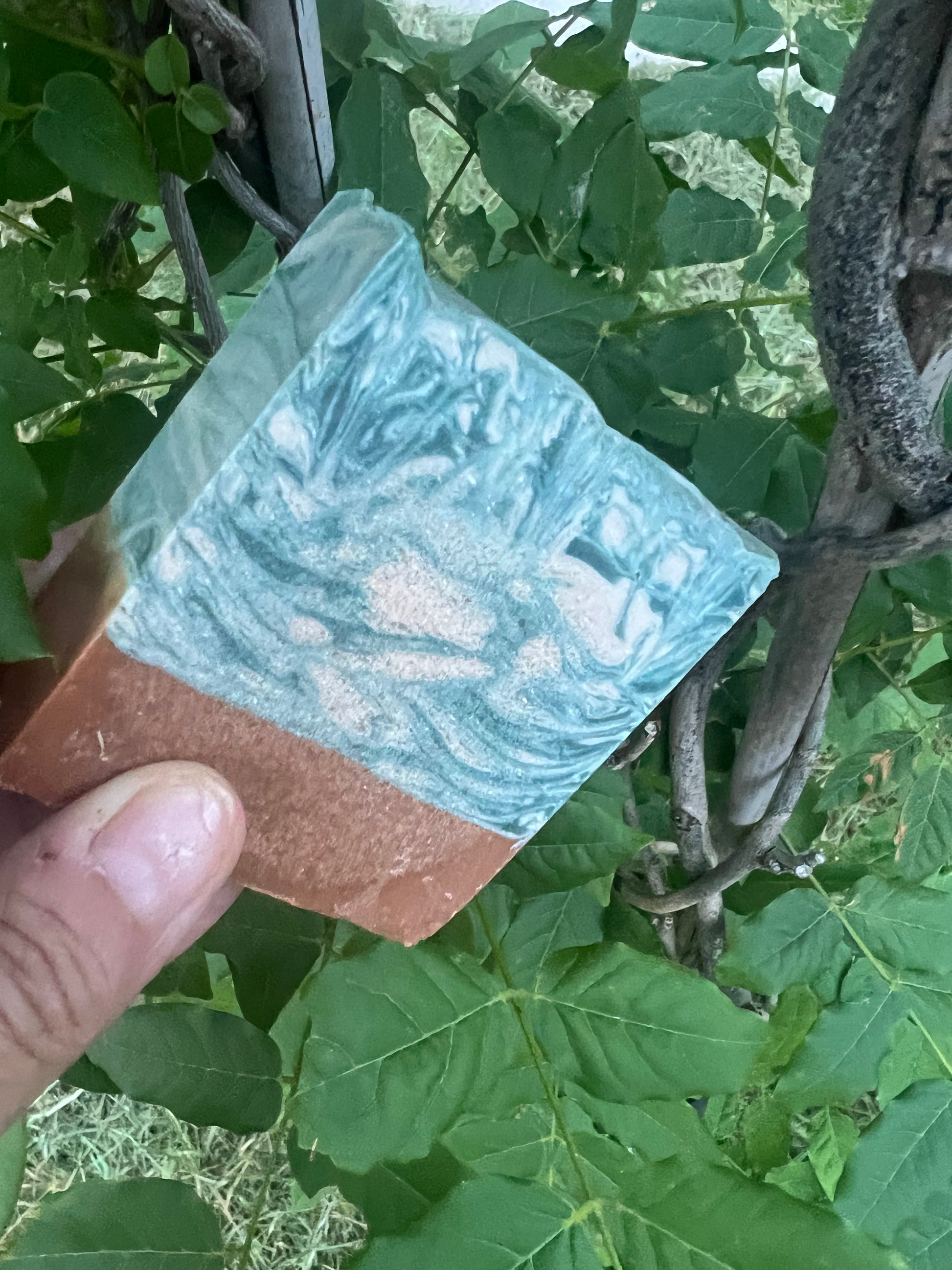 Hand-crafted bar soap showing the thickness and size of the bar.