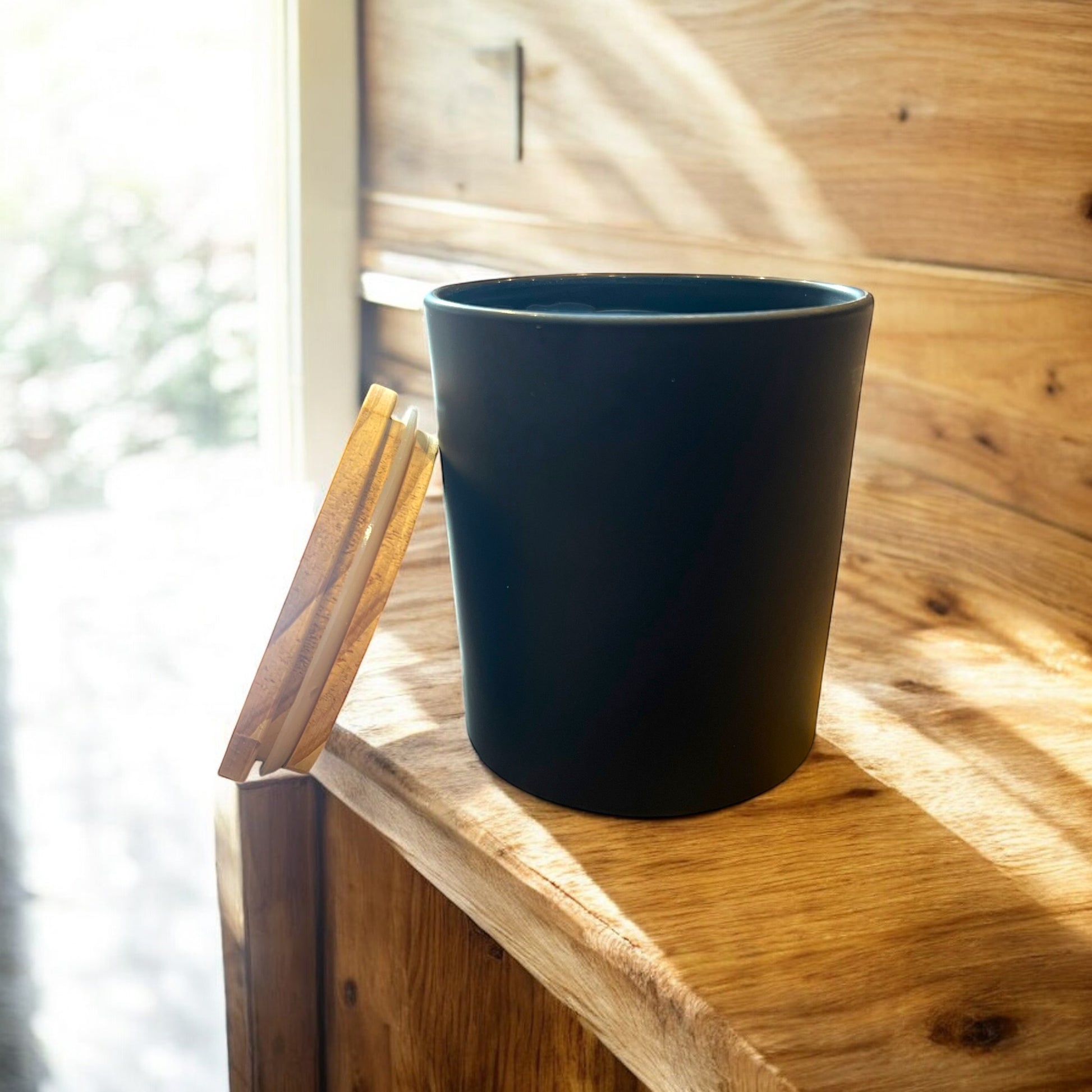 The sleek black 14 ounce matte vessel that holds 11 ounces of premium coconut/paraffin wax