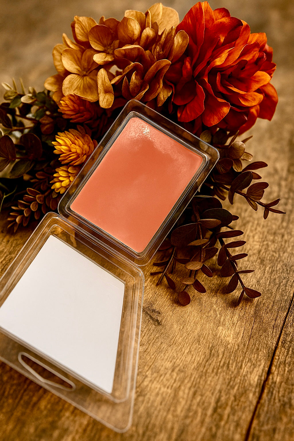 Open pack of wax melts that shows the smooth texture of the soy and beeswax wax in a clamshell. 