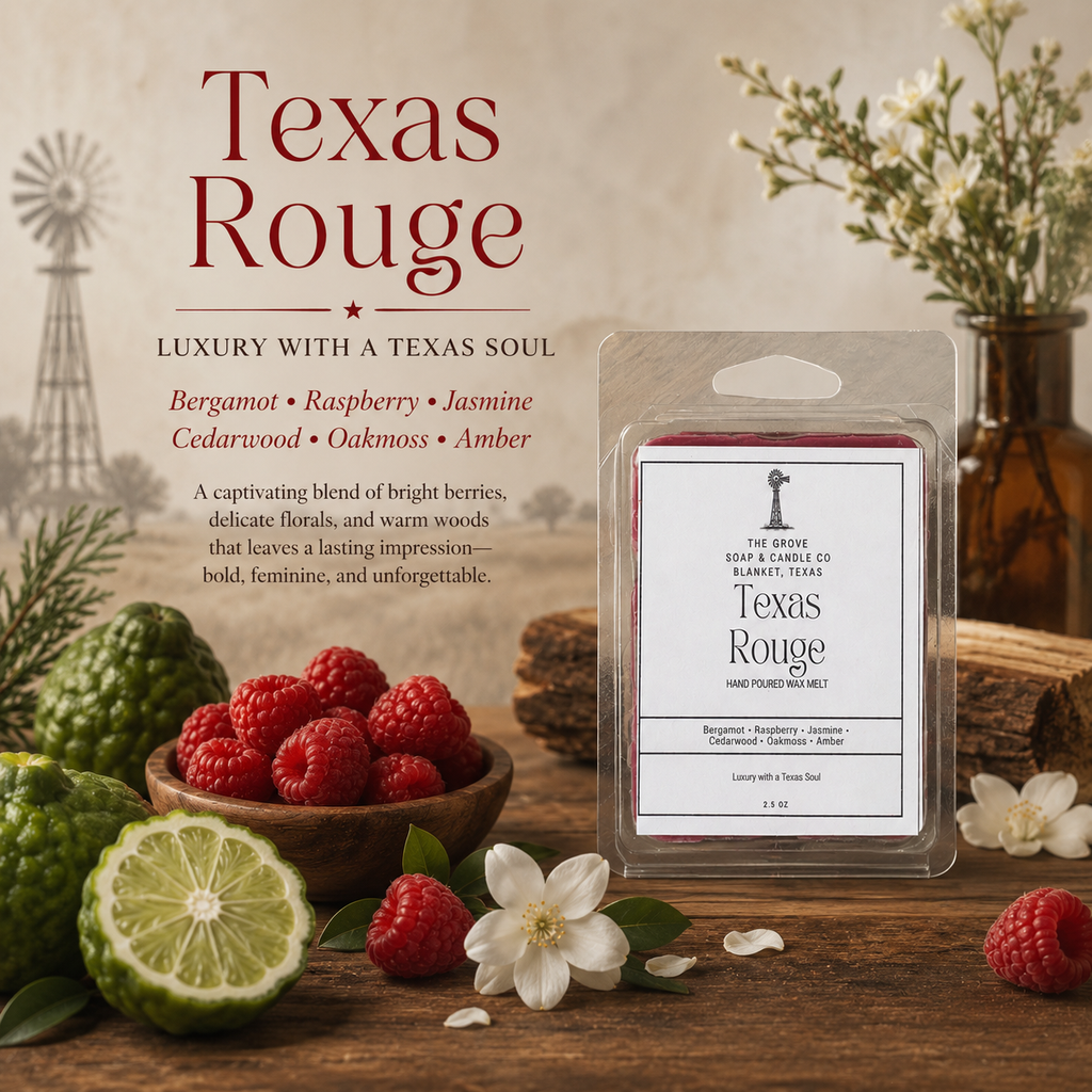 A wax melt package labeled Texas Rouge by The Grove Soap & Candle Co. stands on a rustic wooden surface with berries, a lime, white flowers, and a small windmill illustration in the background