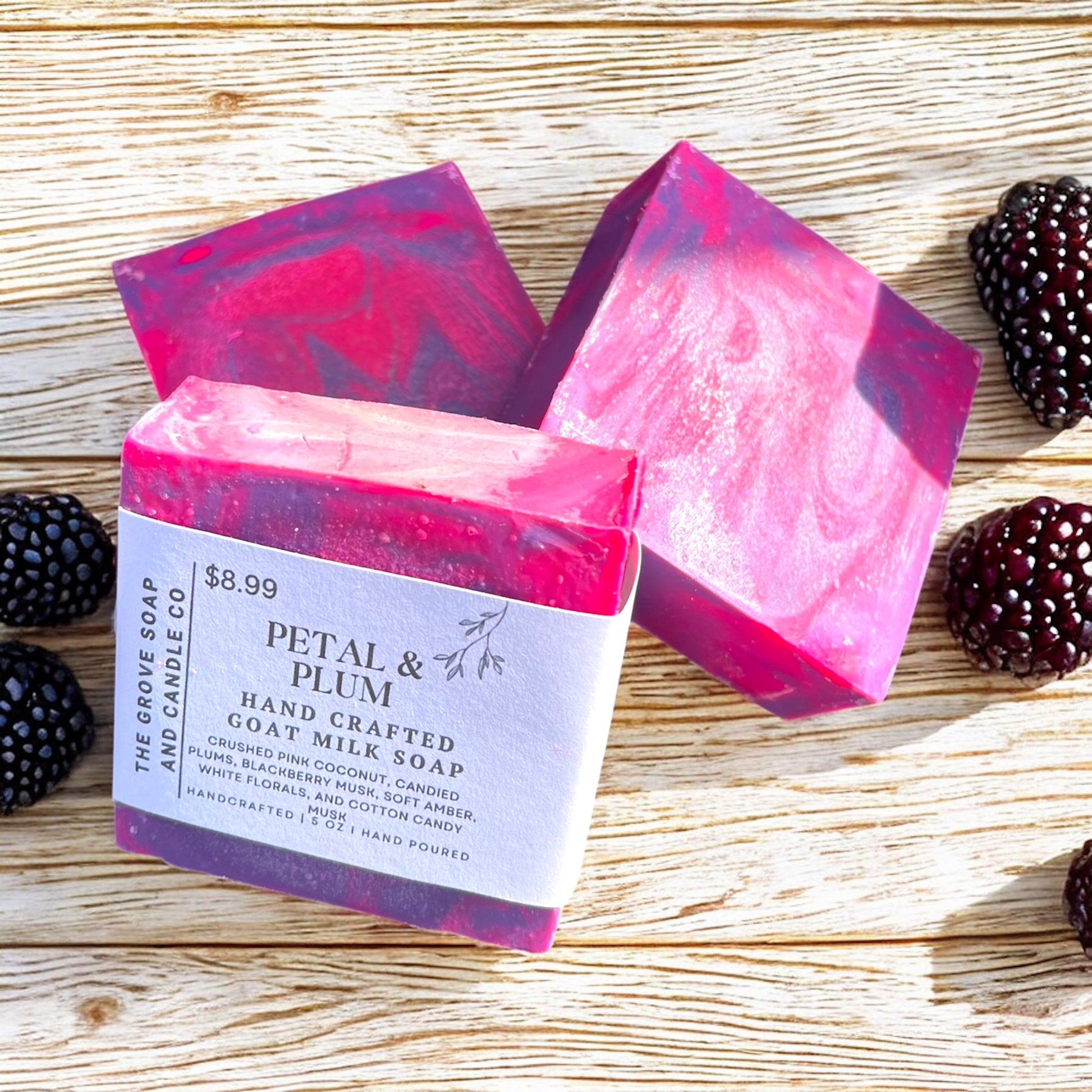 A fun photo of Petal and Plum artesian Soap. Highlighting the aroma of blackberries and the bright colors of the Handpoured cold processed soap. 