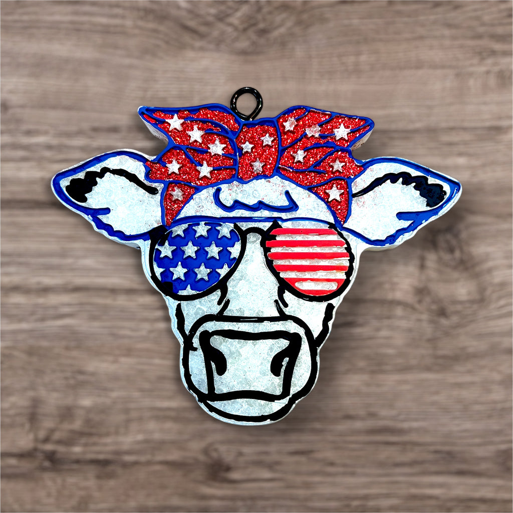 Front view of Moo-rica car freshie cow head. 