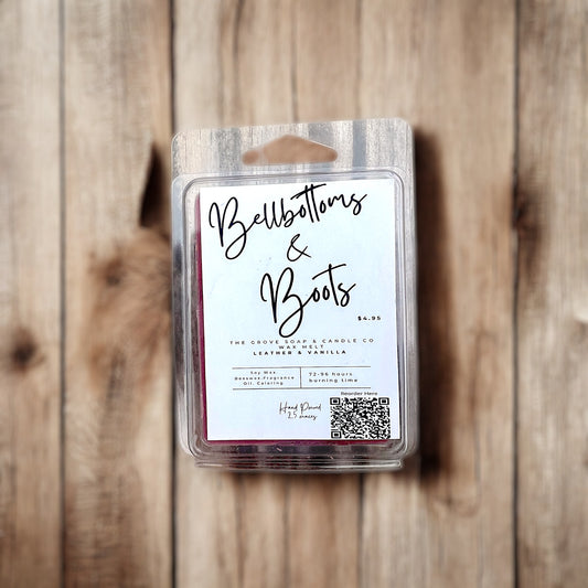 Soy and beeswax blend wax melts labeled Bellbottoms & Boots on farmhouse-style surface and branding from The Grove Soap and Candle Co