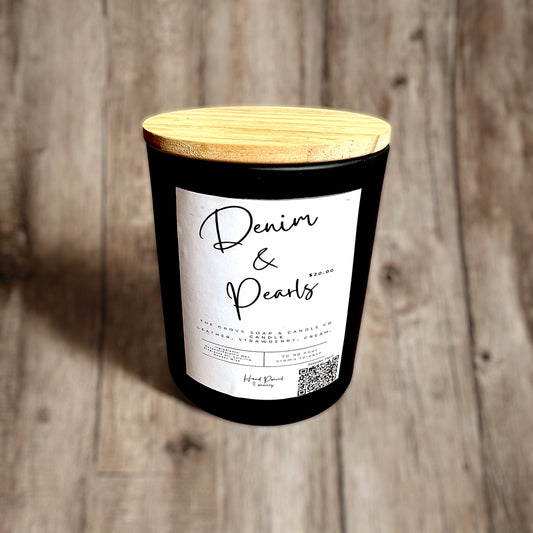 Close-up of Denim & Pearls candle label and wooden lid. Showcasing the packaging and branding of The Grove Soap and Candle Co