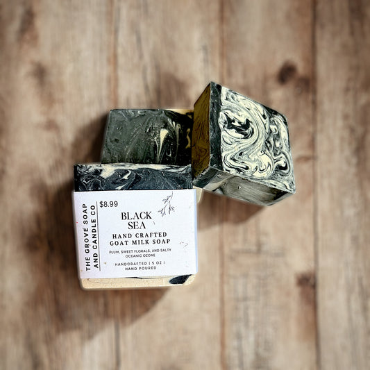 Cold processed soap with plum and ocean scent. Packaged and branded by The Grove Soap and Candle Co