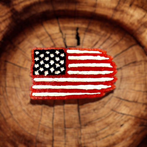 American flag patch on a wooden background