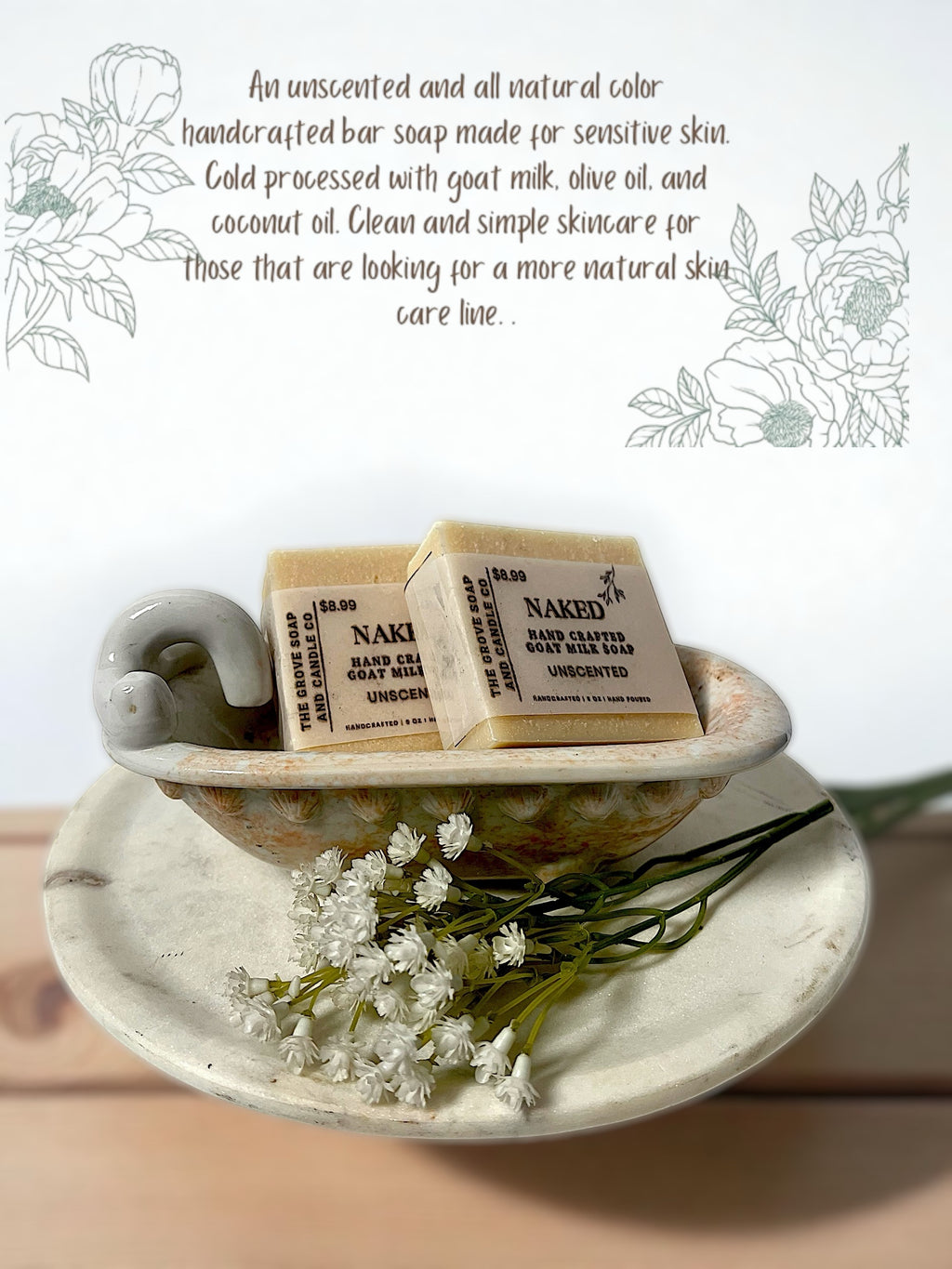 Two bars of Naked Soap in a decorative tub with flowers on a light background with a description of the handcrafted nature of this bar. 