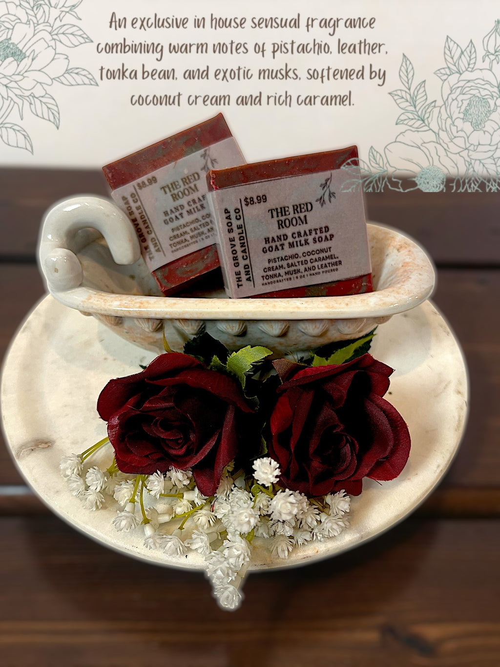 Two soap bars in a porcelain tub with red roses and white flowers on a wooden surface describing the scent of the soap 