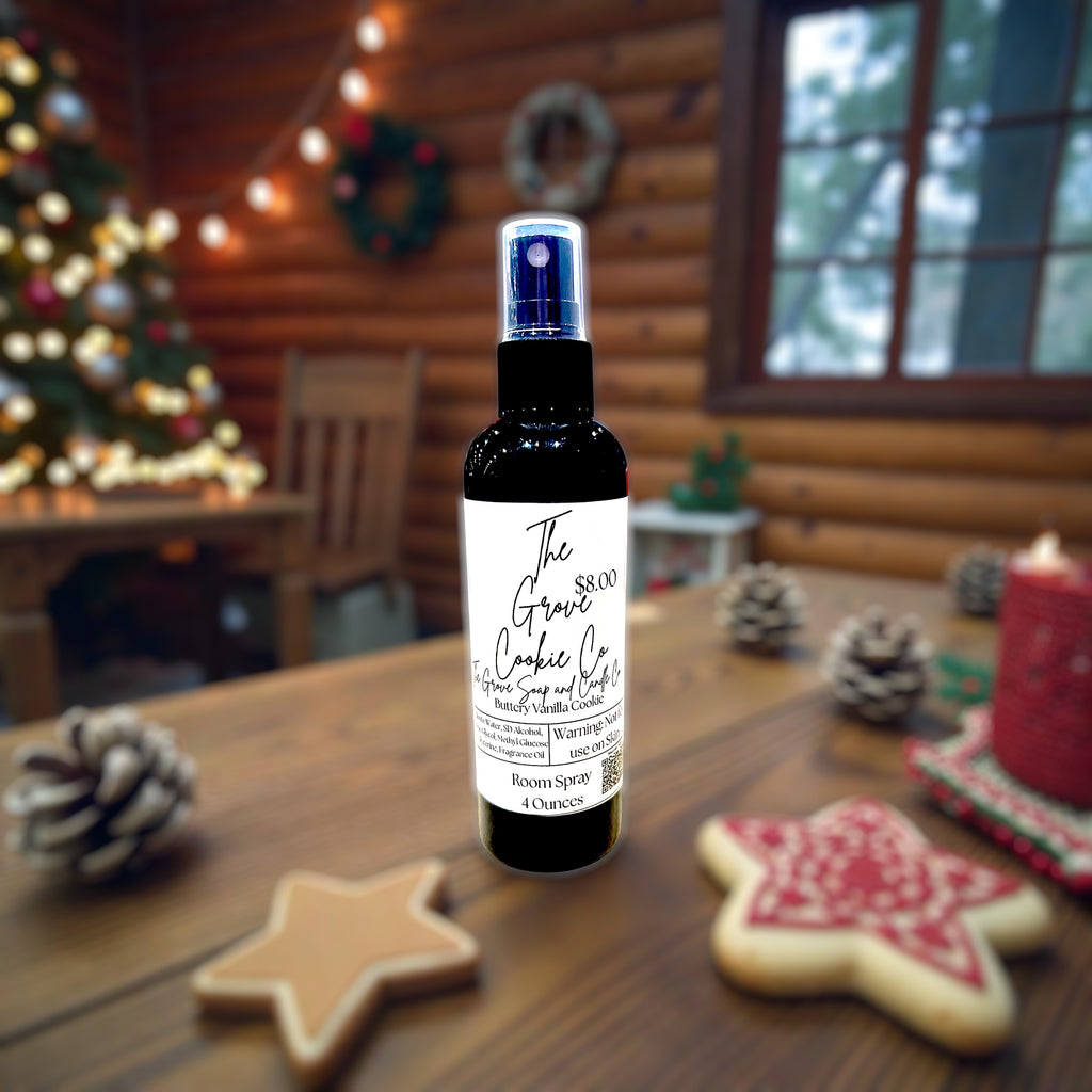 Room spray bottle on a wooden table with Christmas decorations in the background